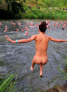 Nudists crowd laying on the ground