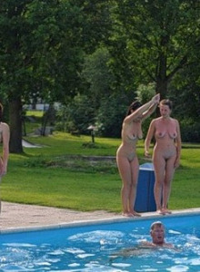 Exciting nudists in the outside pool