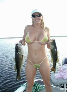 Busty hottie in light yellow bikini with big fish