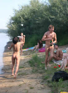 Nudists playing badminton at the river side