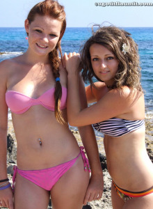 Teens Beth and Laura are in sexy bikinis on the rocky beach