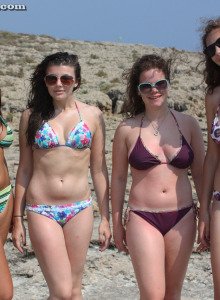 Beth and her girlfriends have fun in bikinis in the sea