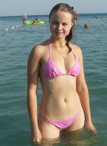 Summer girlfriends on the beach in bikini