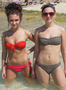Exciting hot teens Evie and Rebbecca are in the sea in red and grey bikinis