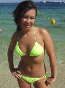 Young brunette hottie Robyn wearing green bikini in the sea