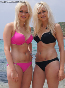 Perfect blonde twins Nicky and Katie in pink and black bikinis on the beach