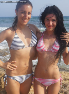 Two brunettes Vika and Lucia are in the sea is sexy zebra pink and blue bikinis