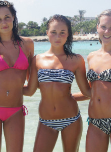 Wonderful young Sophie and her girlfriends are in the sea in sexy pink and zebra bikinis