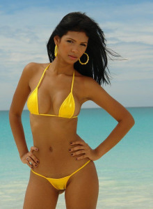 Exciting busty Karla in yellow bikini is topless in the sea