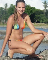 Beautiful fairy Josie is by the river wearing rainbow bikini