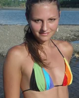 Beautiful fairy Josie is by the river wearing rainbow bikini