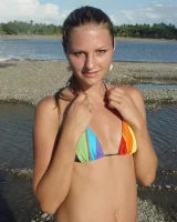 Beautiful fairy Josie is by the river wearing rainbow bikini