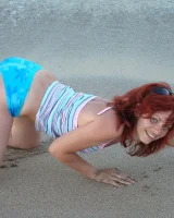 Topless puffy nipples redhead gf Susy is in bikini on the beach