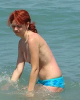 Topless puffy nipples redhead gf Susy is in bikini on the beach