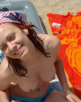 Topless puffy nipples redhead gf Susy is in bikini on the beach